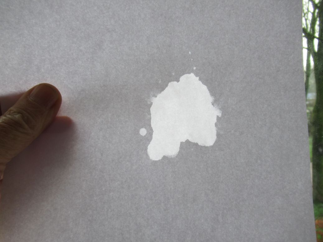 The wet part appears light, it transmits.