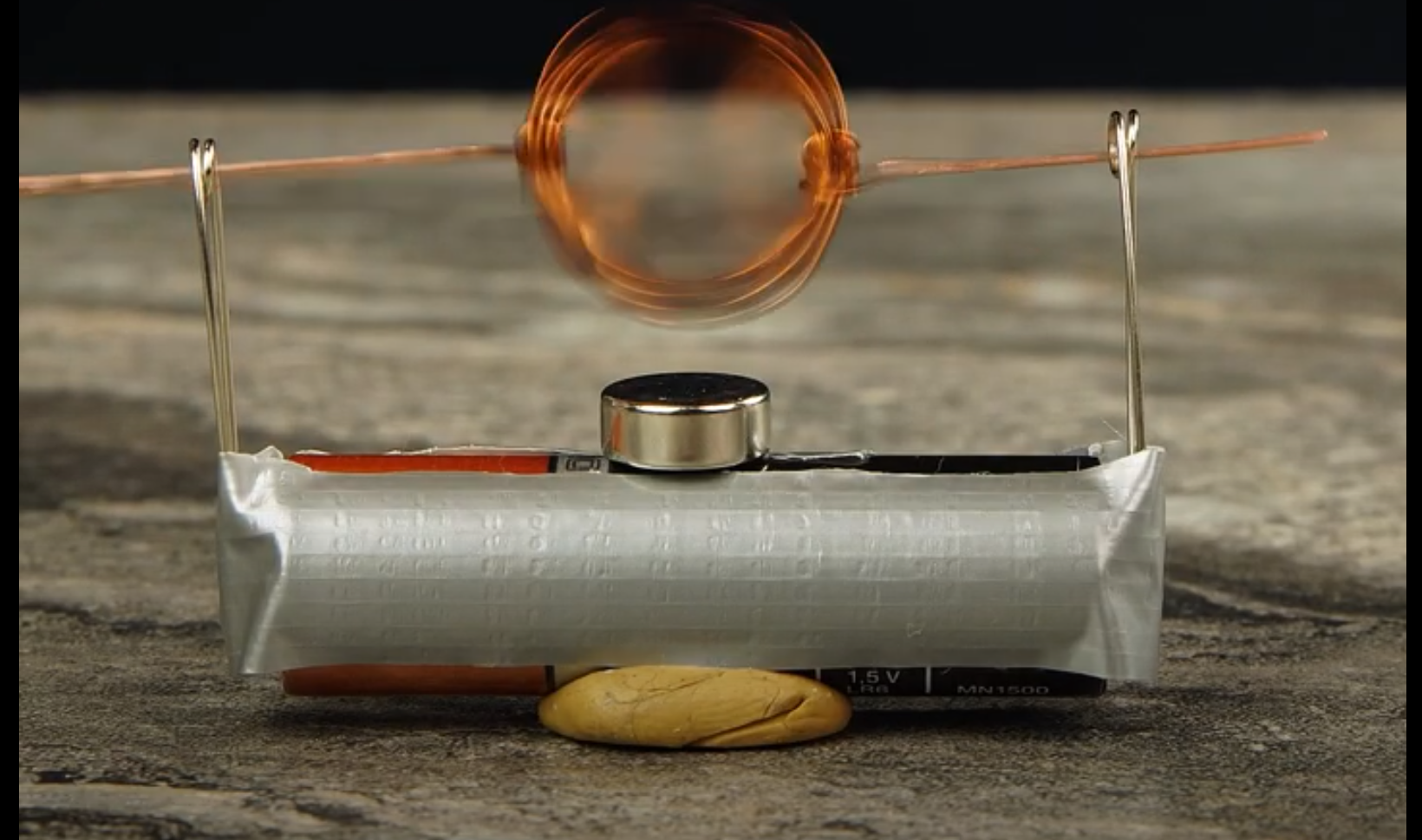 Making a simple electric motor with a battery, wire and magnet.